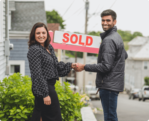 sales agent lady and client giving a handshake after closing the sale